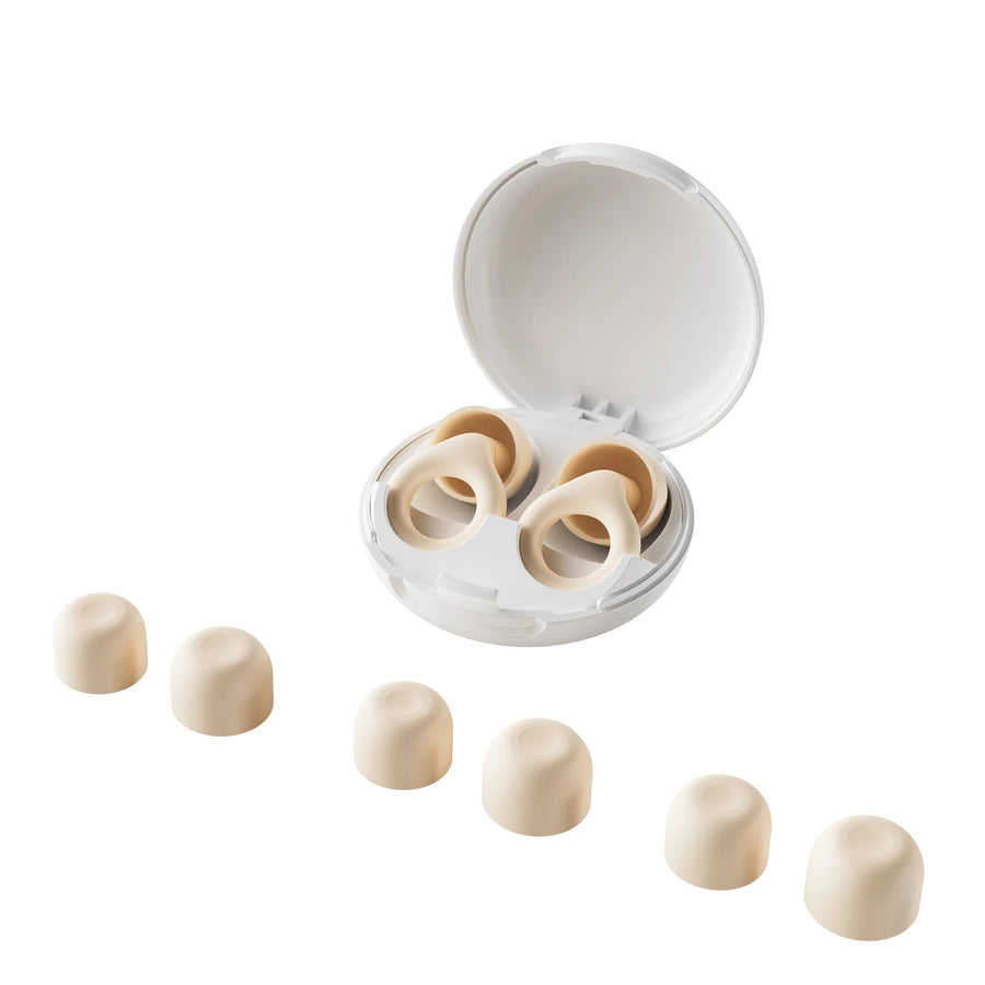 Vespré Slim earplugs beside their case on a nightstand