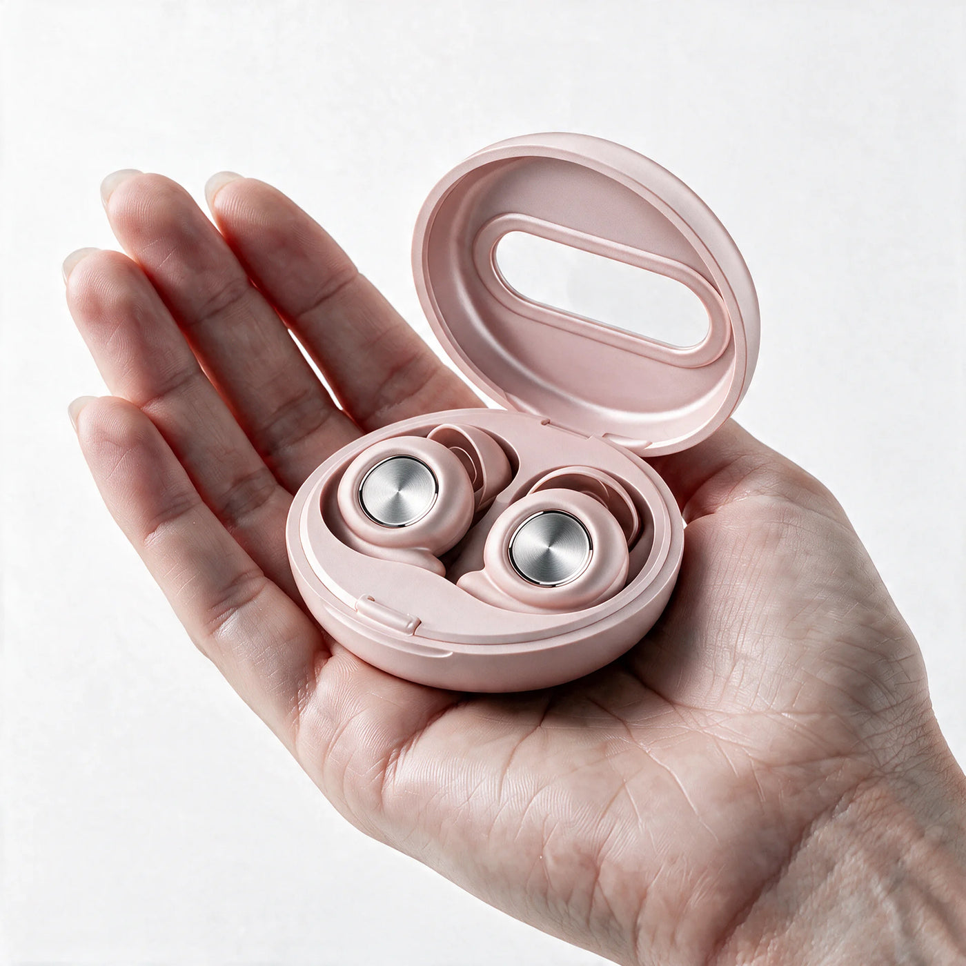 Vespré Pro in Blush, open case held in a hand for scale