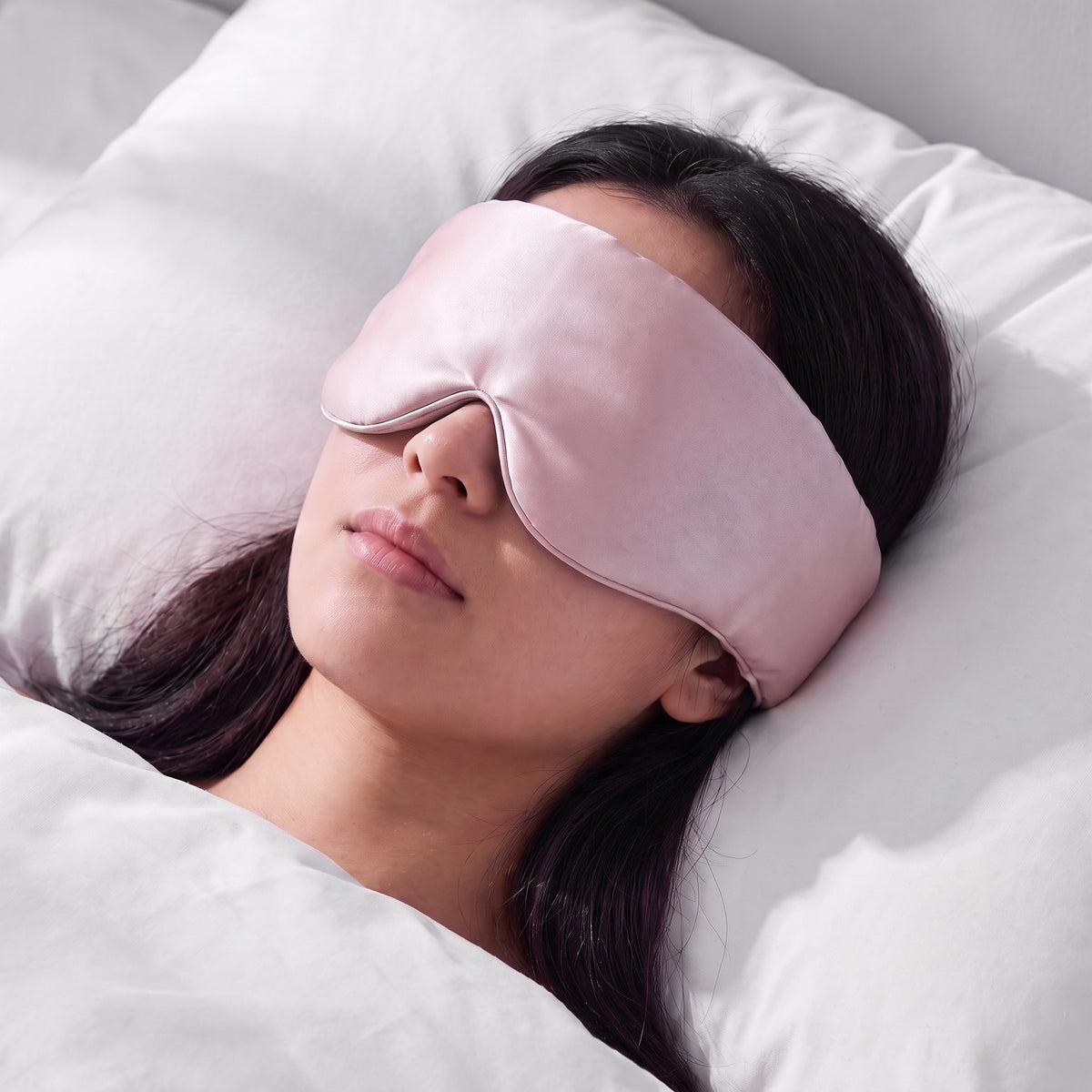 A woman asleep wearing the Vespré Silk Sleep Mask