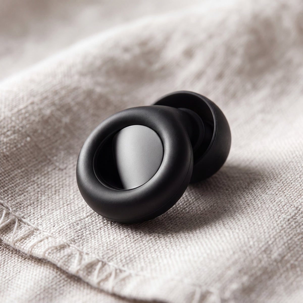 Close-up of a Vespré Deep earplug and its smooth centre insert