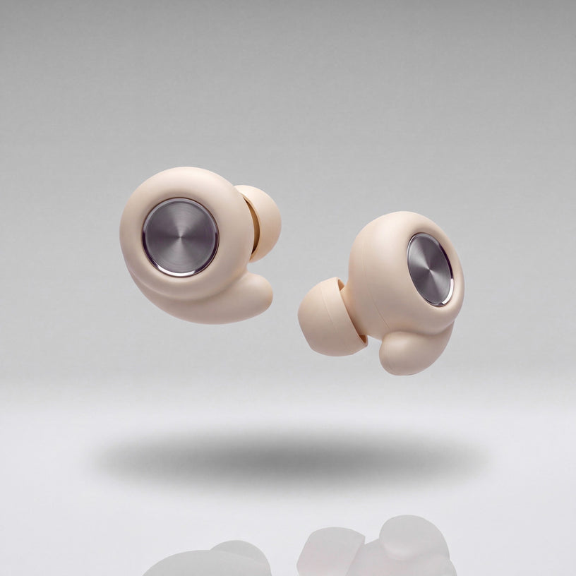 A pair of Vespré Grip earplugs in Ivory