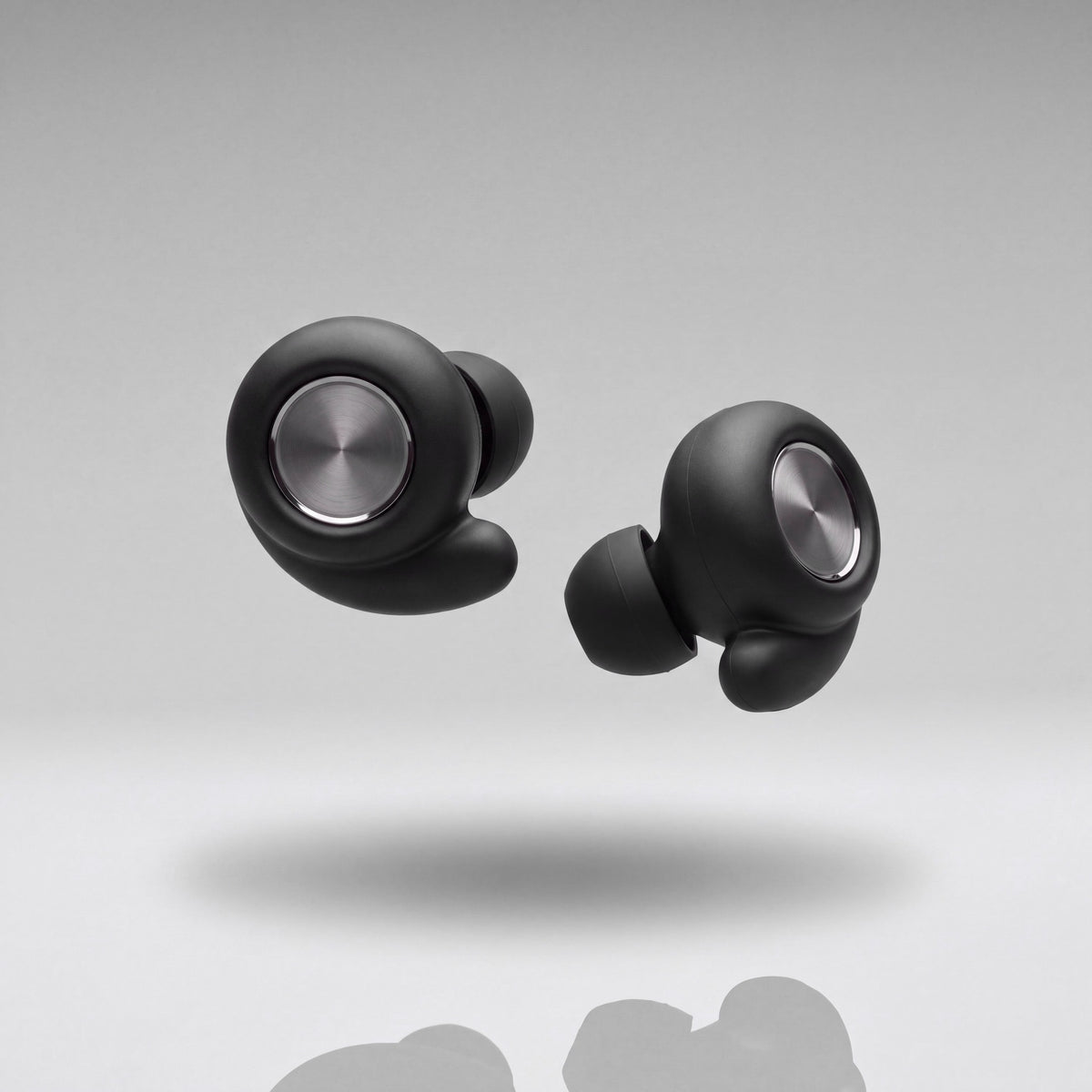 A pair of Vespré Grip earplugs in Matte Black