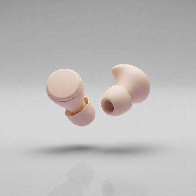 A pair of Vespré Rest earplugs in Ivory
