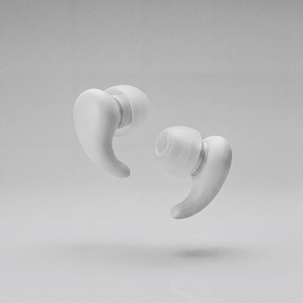 A pair of Vespré Wing earplugs in Cloud