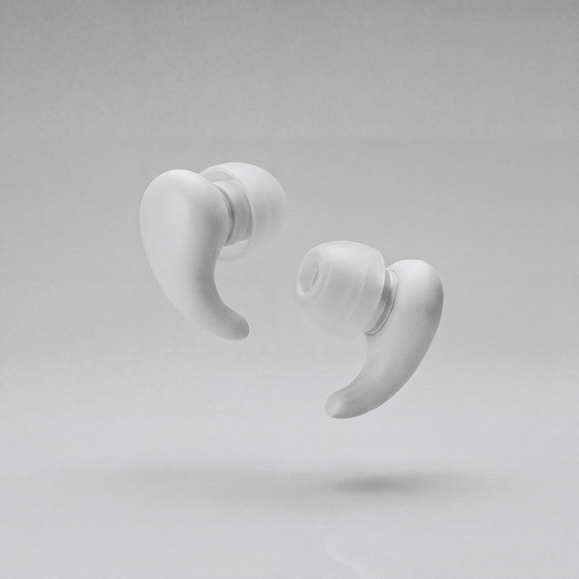 A pair of Vespré Wing earplugs in Cloud